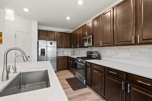 153 N Bend Way, Elgin, IL 60124 - kitchen featuring stainless steel appliances, light countertops, decorative backsplash, and recessed lighting