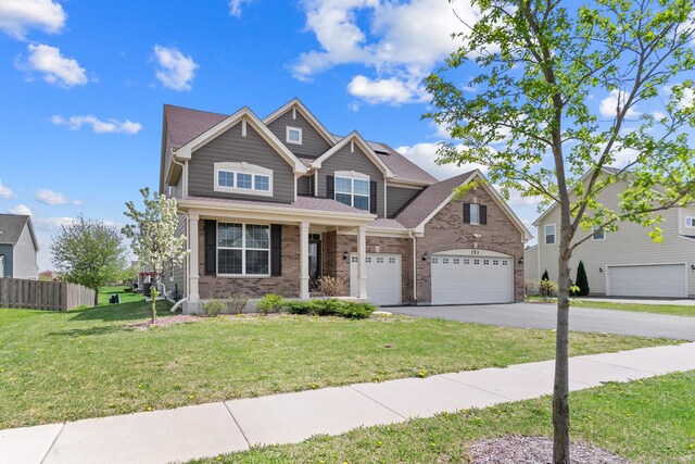 153 N Bend Way, Elgin, IL 60124 - view of front of property featuring driveway, brick siding, and a garage