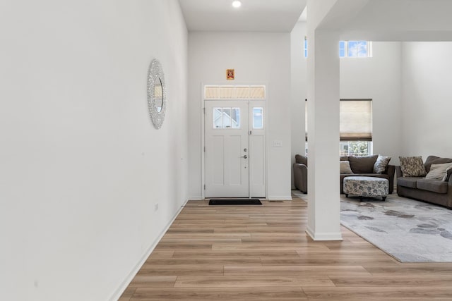 153 N Bend Way, Elgin, IL 60124 - entryway with light wood-style floors, a high ceiling, healthy amount of natural light, and recessed lighting