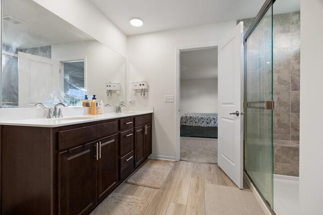153 N Bend Way, Elgin, IL 60124 - full bathroom with wood finished floors, ensuite bathroom, double vanity, and a shower stall