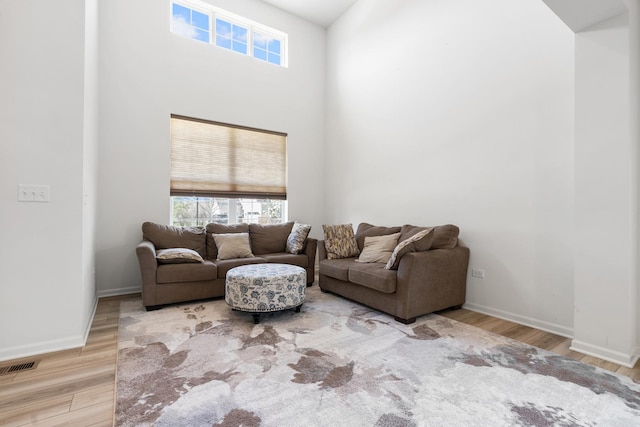 153 N Bend Way, Elgin, IL 60124 - living room with wood finished floors, a high ceiling, and plenty of natural light
