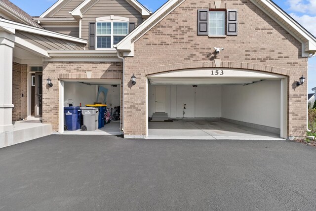 153 N Bend Way, Elgin, IL 60124 - garage featuring driveway