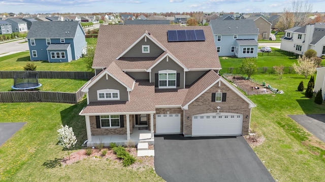 153 N Bend Way, Elgin, IL 60124 - traditional-style home featuring a porch, a residential view, driveway, and roof mounted solar panels