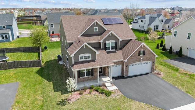 153 N Bend Way, Elgin, IL 60124 - traditional-style house with a residential view, a shingled roof, asphalt driveway, and a porch