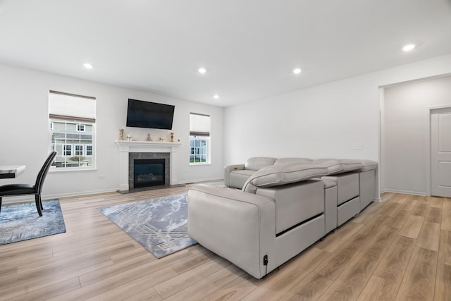 153 N Bend Way, Elgin, IL 60124 - living room with light wood finished floors, healthy amount of natural light, recessed lighting, and a high end fireplace