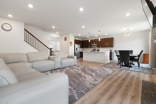 153 N Bend Way, Elgin, IL 60124 - living room featuring recessed lighting, light wood-style floors, and stairs