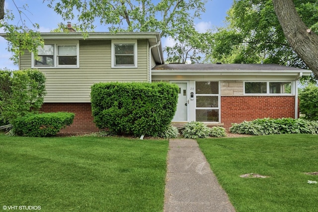 217 Heather Ln, Wilmette, IL 60091 - tri-level home with a front lawn and brick siding