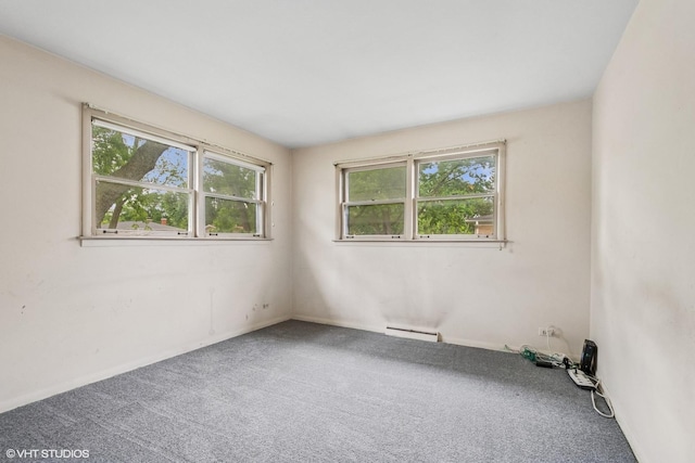 217 Heather Ln, Wilmette, IL 60091 - spare room featuring a baseboard radiator, plenty of natural light, and carpet floors