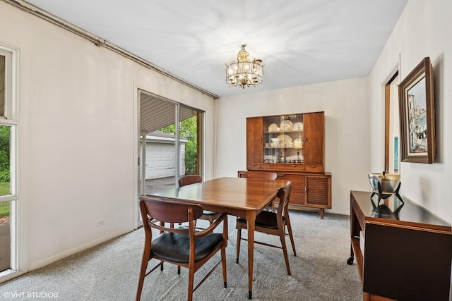 217 Heather Ln, Wilmette, IL 60091 - dining area featuring light colored carpet and a chandelier