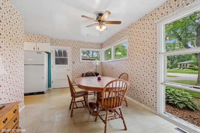 217 Heather Ln, Wilmette, IL 60091 - dining room featuring wallpapered walls, light floors, plenty of natural light, and ceiling fan