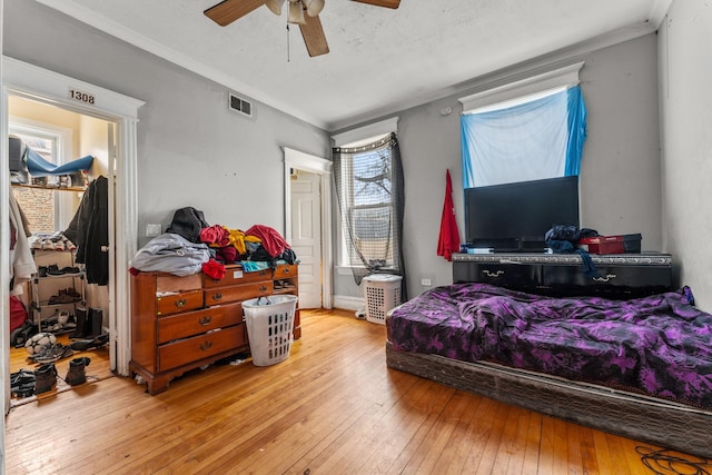 2330 S Homan Ave, Chicago, IL 60623 - bedroom featuring hardwood / wood-style flooring, crown molding, and a ceiling fan