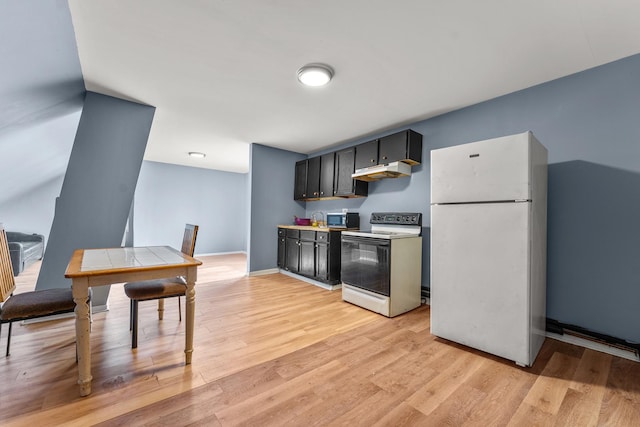 2330 S Homan Ave, Chicago, IL 60623 - kitchen featuring white appliances, under cabinet range hood, light wood-type flooring, and dark cabinetry