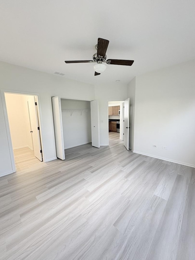 1412 Sherborn Ct, Minooka, IL 60447 - unfurnished bedroom featuring light wood-style floors, a closet, ceiling fan, and ensuite bathroom
