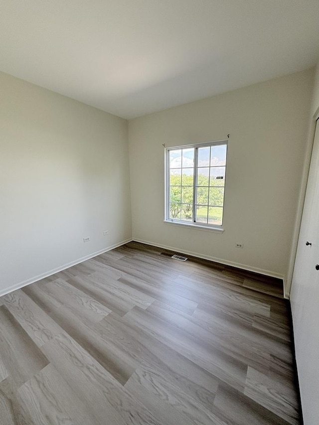 1412 Sherborn Ct, Minooka, IL 60447 - spare room with wood finished floors and baseboards