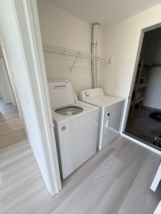 1412 Sherborn Ct, Minooka, IL 60447 - laundry room featuring light wood-style flooring and washing machine and dryer