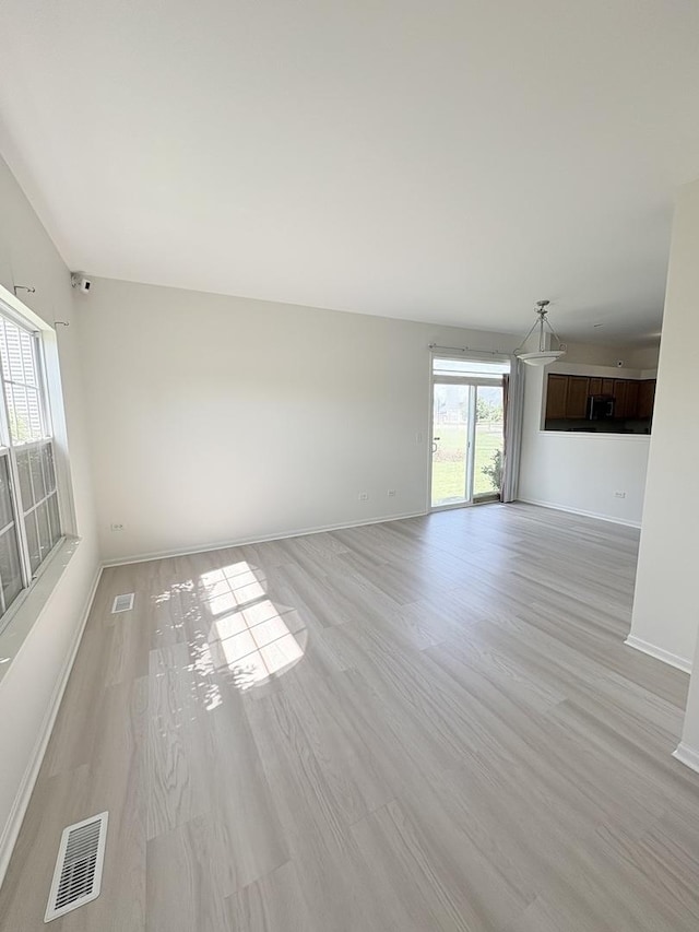 1412 Sherborn Ct, Minooka, IL 60447 - empty room featuring baseboards and light wood-style floors