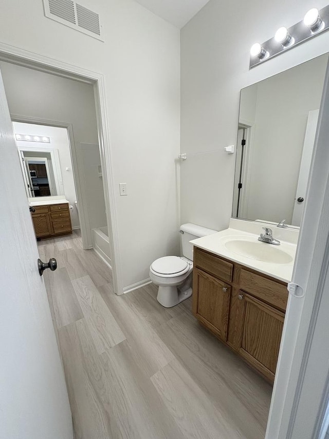 1412 Sherborn Ct, Minooka, IL 60447 - bathroom featuring vanity and wood finished floors