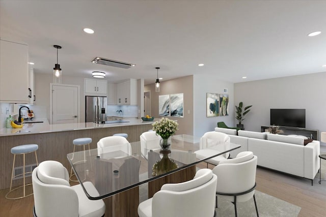 7418 Kildare Ave, Skokie, IL 60076 - dining space featuring light wood-style flooring and recessed lighting