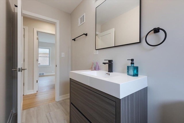 7418 Kildare Ave, Skokie, IL 60076 - bathroom with vanity and baseboards