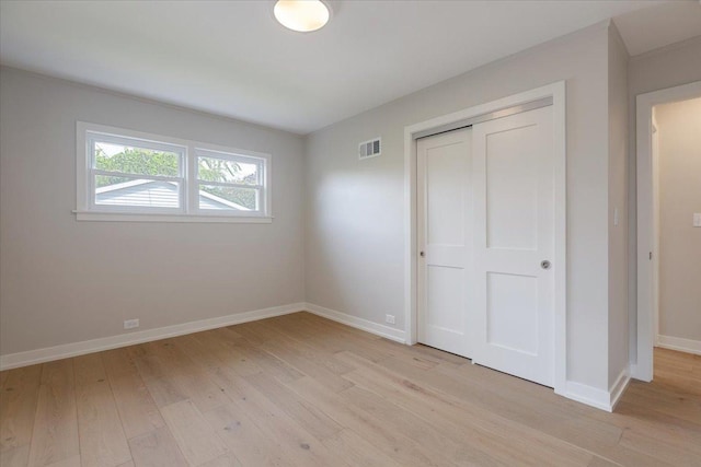 7418 Kildare Ave, Skokie, IL 60076 - unfurnished bedroom with light wood finished floors and a closet