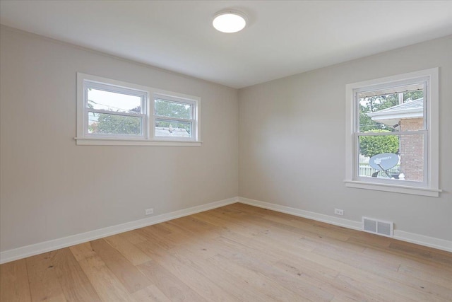 7418 Kildare Ave, Skokie, IL 60076 - empty room featuring healthy amount of natural light and light wood-style flooring