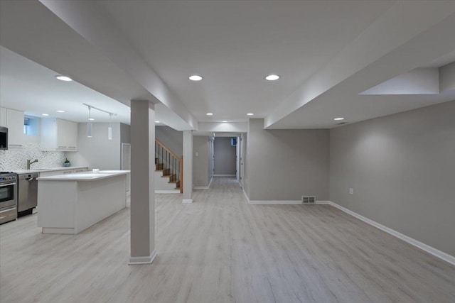 7418 Kildare Ave, Skokie, IL 60076 - finished basement with light wood-style floors, recessed lighting, and stairs