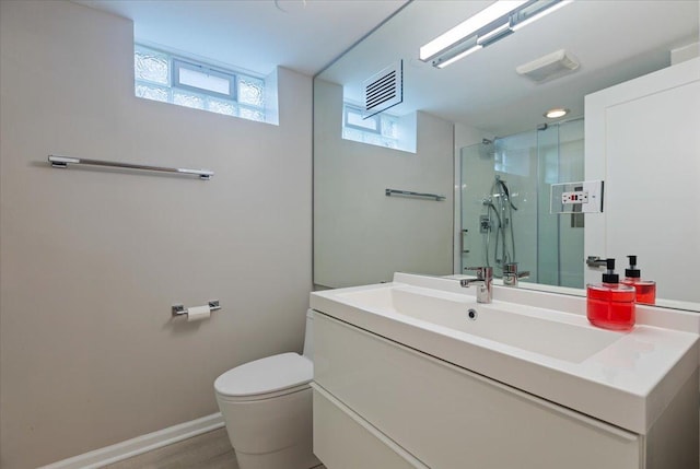 7418 Kildare Ave, Skokie, IL 60076 - full bathroom featuring vanity, a shower stall, and wood finished floors