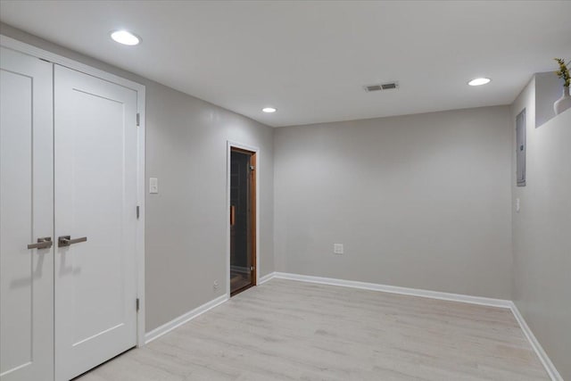 7418 Kildare Ave, Skokie, IL 60076 - unfurnished room with light wood finished floors, electric panel, and recessed lighting