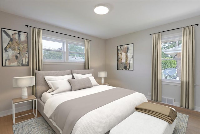 7418 Kildare Ave, Skokie, IL 60076 - bedroom featuring wood finished floors and multiple windows