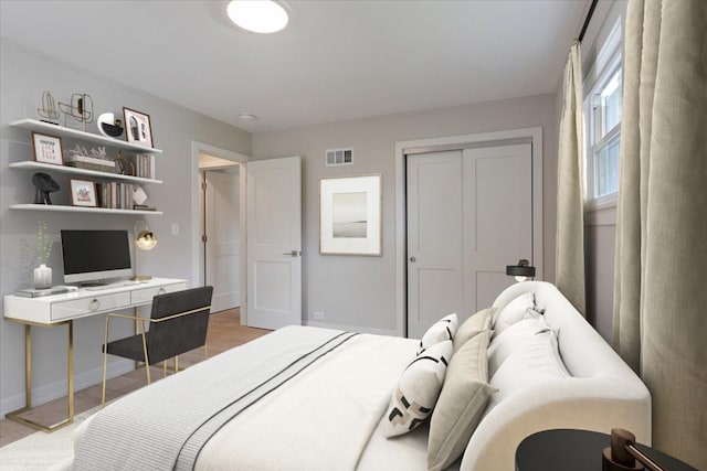 7418 Kildare Ave, Skokie, IL 60076 - bedroom featuring an office area, a closet, and light wood-style flooring