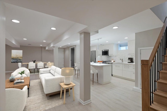 7418 Kildare Ave, Skokie, IL 60076 - living room with recessed lighting, stairs, and light wood-style flooring