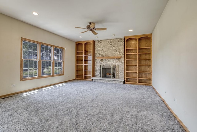 2504 Monterey Dr, Plainfield, IL 60586 - unfurnished living room featuring built in features, a ceiling fan, carpet, recessed lighting, and a brick fireplace