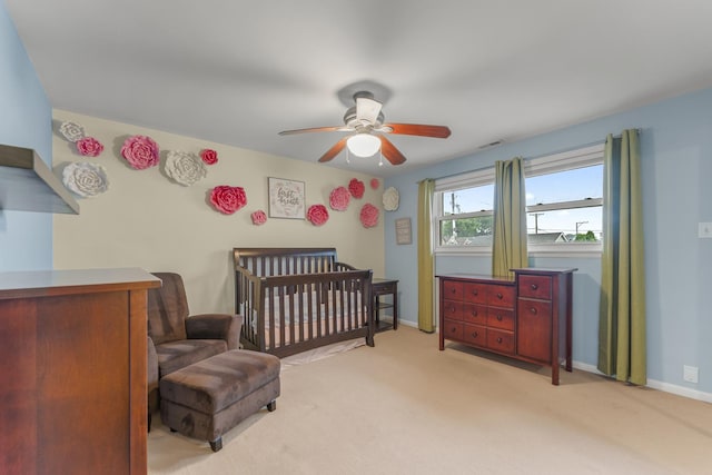 3257 N Nottingham Ave, Chicago, IL 60634 - bedroom with a crib, light carpet, and a ceiling fan