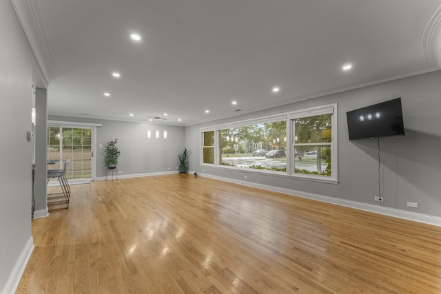 3257 N Nottingham Ave, Chicago, IL 60634 - unfurnished living room with ornamental molding, light wood-type flooring, and recessed lighting