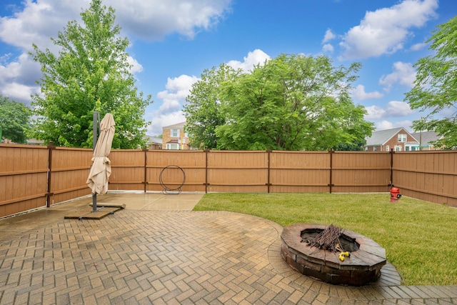 3257 N Nottingham Ave, Chicago, IL 60634 - fenced backyard featuring a patio and a fire pit