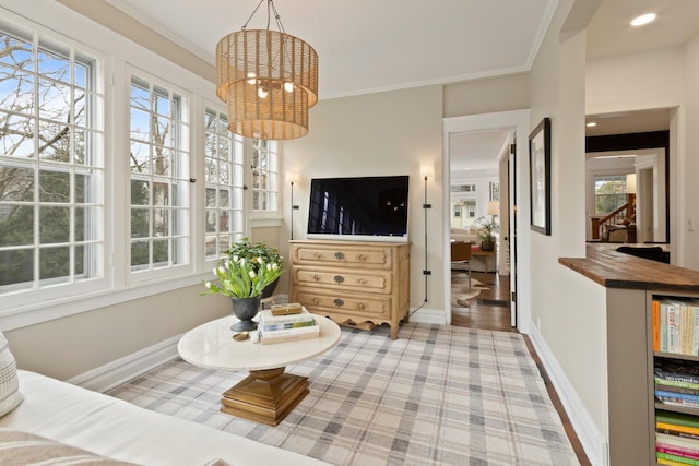 1123 Linden Ave, Wilmette, IL 60091 - living area featuring plenty of natural light, a chandelier, stairway, and crown molding