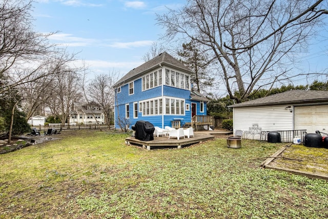 1123 Linden Ave, Wilmette, IL 60091 - rear view of property featuring a deck, an outbuilding, roof with shingles, and a garage