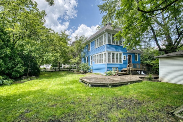 1123 Linden Ave, Wilmette, IL 60091 - back of property featuring a wooden deck and a lawn
