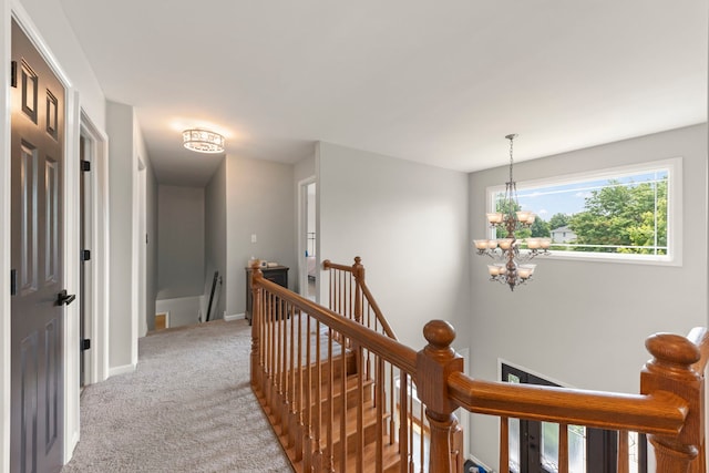 24006 Skyler Ln, Plainfield, IL 60586 - hallway featuring an upstairs landing, light colored carpet, and a chandelier