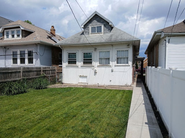 4936 S Karlov Ave, Chicago, IL 60632 - rear view of property with a fenced backyard and roof with shingles