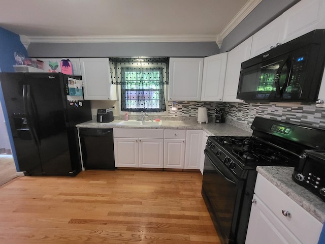 604 Parkshore Dr, Shorewood, IL 60404 - kitchen featuring black appliances, crown molding, white cabinetry, light wood-style floors, and light countertops