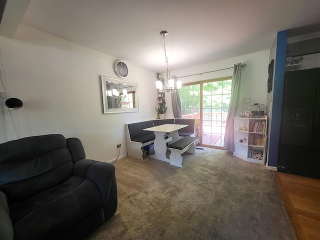 604 Parkshore Dr, Shorewood, IL 60404 - carpeted dining area featuring a chandelier