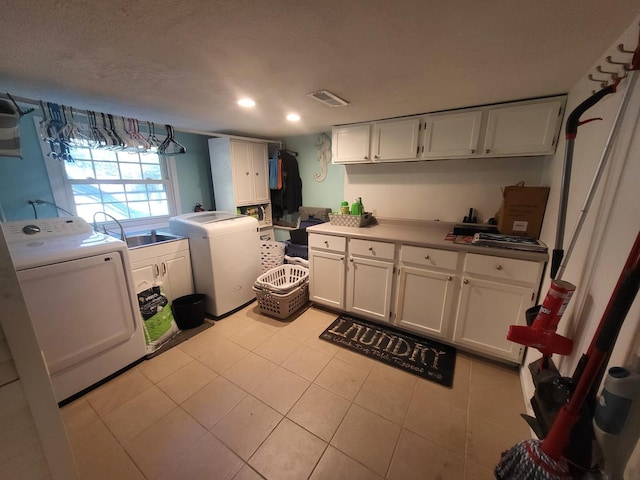 604 Parkshore Dr, Shorewood, IL 60404 - washroom featuring cabinet space, washer and dryer, recessed lighting, and light tile patterned floors