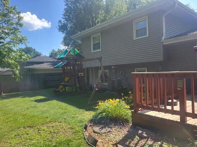 604 Parkshore Dr, Shorewood, IL 60404 - back of house featuring a playground and a wooden deck