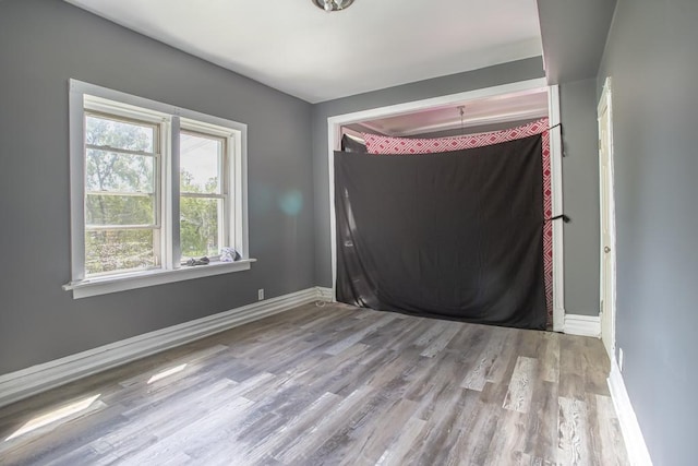 3810 W Ohio St, Chicago, IL 60624 - unfurnished room featuring wood finished floors and baseboards
