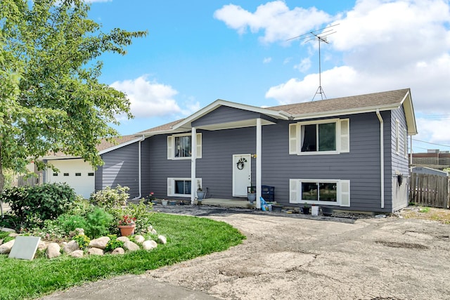 4N425 N 7th Ave, Addison, IL 60101 - raised ranch featuring an attached garage and roof with shingles