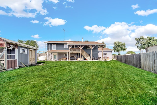 4N425 N 7th Ave, Addison, IL 60101 - rear view of property with stairs, a fenced backyard, an outdoor structure, and a wooden deck