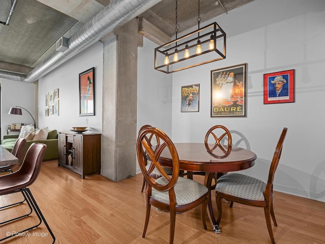833 W 15th Pl Unit 502, Chicago, IL 60608 - dining room with light wood-style floors and a chandelier