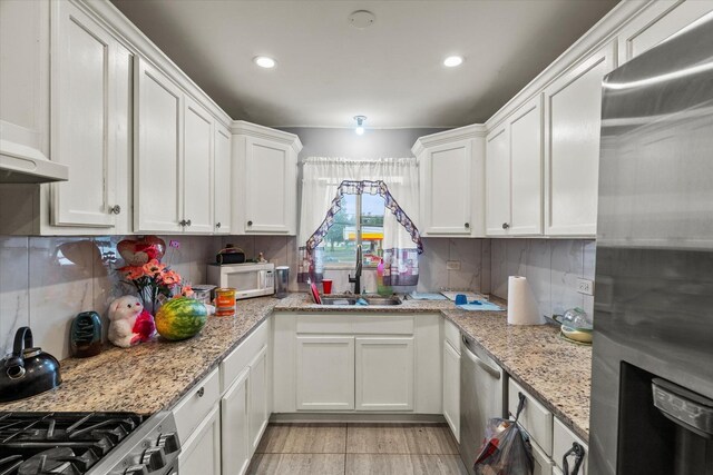 14501 Keystone Ave Unit 8, Midlothian, IL 60445 - kitchen with stainless steel appliances, white cabinets, tasteful backsplash, recessed lighting, and light stone counters