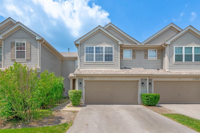 2012 Juniper Ct Unit 2012, Glendale Heights, IL 60139 - view of property with an attached garage and asphalt driveway